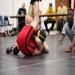 Jessi Kimmerli securing the pin.  Leo Rhodes enthusiastically concurs.